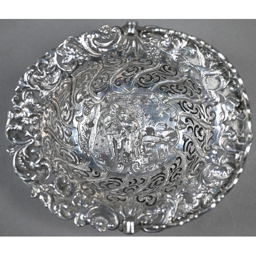 86 - A Victorian silver bonbon basket, embossed with a rustic courting couple, in decorative pierced surr... 