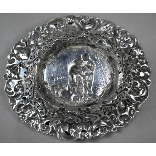 86 - A Victorian silver bonbon basket, embossed with a rustic courting couple, in decorative pierced surr... 