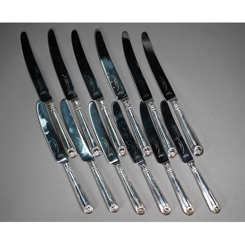 90 - A set of six thread and shell table knives and cheese knives with loaded silver handles, John B Chat... 