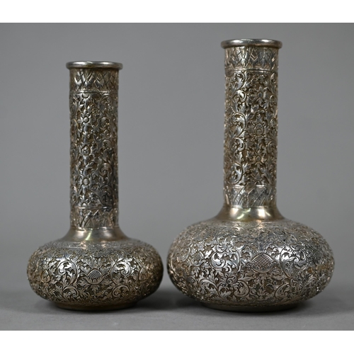 93 - A graduated pair of Chinese Himalayan Shan silver bottle vases with floral-chased decoration, stampe... 
