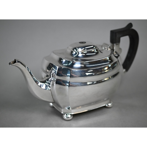 97 - A silver three-piece tea service in the Regency manner with composite handle, on bun feet, Roberts &... 