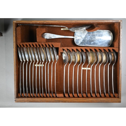 100 - An oak canteen fitted with a complete and original set of silver flatware with lancet finials, compr... 