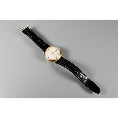 423 - An IWC 18k gent's wristwatch, the 36 mm case with red seconds sweep, on leather strap, 39 g all-in, ... 