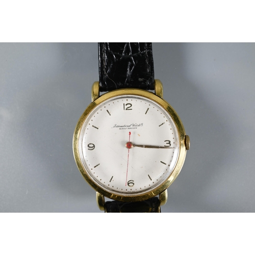 423 - An IWC 18k gent's wristwatch, the 36 mm case with red seconds sweep, on leather strap, 39 g all-in, ... 