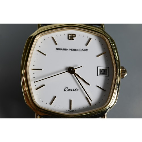 424 - Girard Perregaux, a gent's yellow metal cased wristwatch, quartz movement on leather strap, in fitte... 