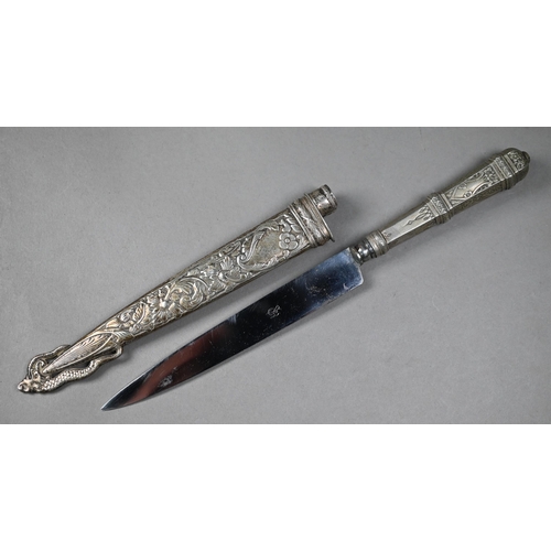 1002 - A Gaucho boot-knife with 15 cm stainless steel blade on engraved white metal hilt and foliate-chased... 