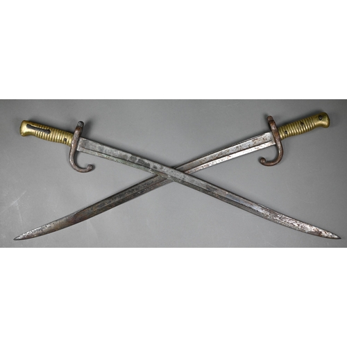 1003 - Two 19th century French infantry bayonets, St Etienne-type, dated 1870/74, with recurved 57 cm fulle... 