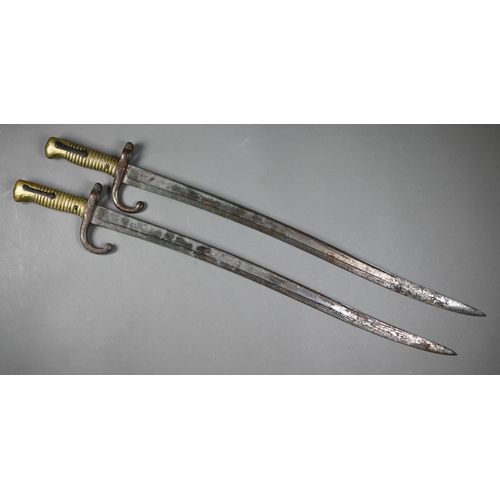 1003 - Two 19th century French infantry bayonets, St Etienne-type, dated 1870/74, with recurved 57 cm fulle... 