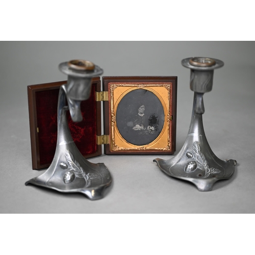 1009 - AMENDMENT - AMBROTYPE NOT DAGUERROTYPE A pair of WMF Art Nouveau pewter candlesticks, 13 cm high, to... 