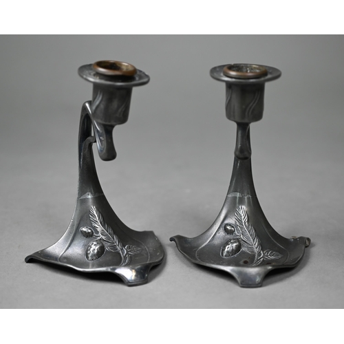 1009 - AMENDMENT - AMBROTYPE NOT DAGUERROTYPE A pair of WMF Art Nouveau pewter candlesticks, 13 cm high, to... 