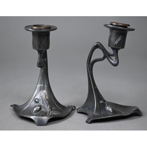 1009 - AMENDMENT - AMBROTYPE NOT DAGUERROTYPE A pair of WMF Art Nouveau pewter candlesticks, 13 cm high, to... 