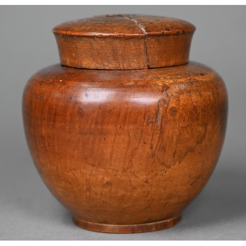 1010 - A Georgian turned wood tea caddy, modelled as an apple, 11 cm high, to/w a turned fruitwood jar and ... 