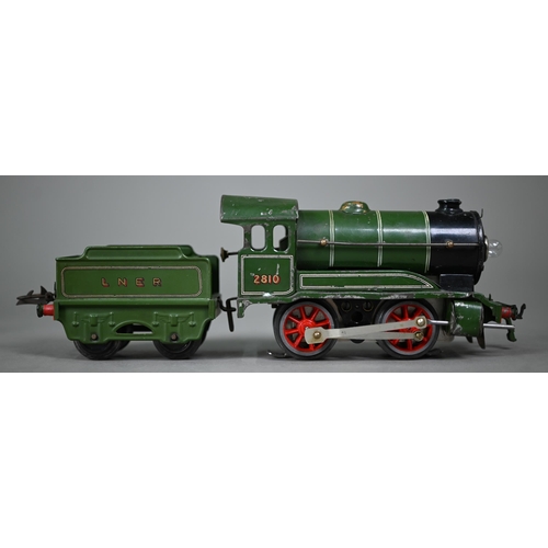 1020 - A boxed Bassett-Lowke scale model L.M.S. 4-4-0 electric locomotive and tender, lightly played-with, ... 