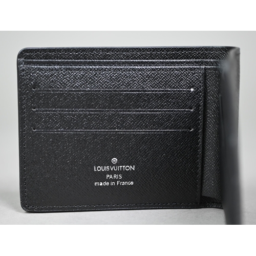 1023 - Louis Vuitton - A gent's black and grey folding wallet, with protective pouch and cardboard box