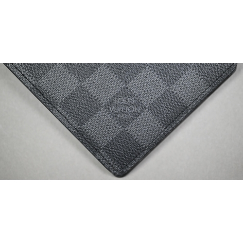 1023 - Louis Vuitton - A gent's black and grey folding wallet, with protective pouch and cardboard box