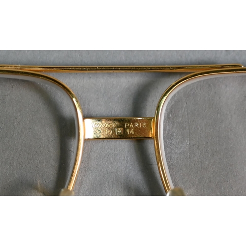 1024 - Must de Cartier - A pair of optical glasses, Vendome Louis Cartier, stamped 59 14 to nose bridge, in... 