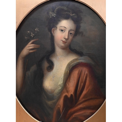704 - An 18th century portrait of a young lady holding a white flower, oil on canvas, 79 x 66 cm frame a/f... 