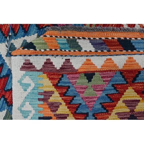 726 - A contemporary Anatolian Kelim, the repeating geometric lozenge design executed in multi-colours, on... 