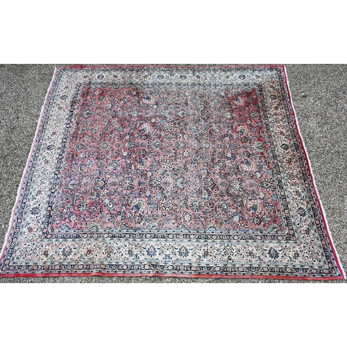 729 - A large Indo Persian Sarouk carpet, the lozenge pole design on pale salmon ground, 400 cm x 361 cm