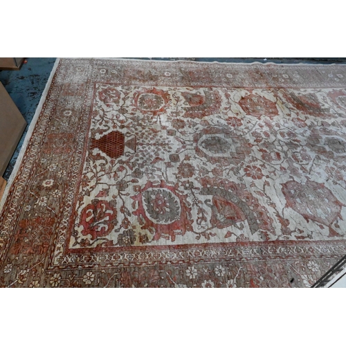 733 - An Indian Agra carpet, mid 20th century, the traditional geometric design on muted ground, 360 cm x ... 