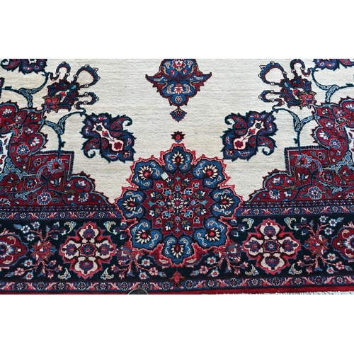 734 - A North East Persian Meshed carpet, the camel ground centred with a blue medallion, 440 cm x 300 cm