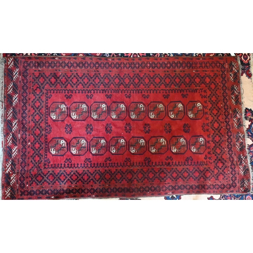736 - An old Turkoman gul design rug, red ground, 187 cm x 109 cm