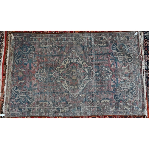 738 - An old Persian Hamadan rug, the red ground centred by a floral medallion, 204 cm x 125 cm