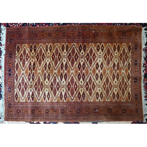739 - A contemporary Persian Turkoman design rug, camel ground, 189 cm x 130 cm