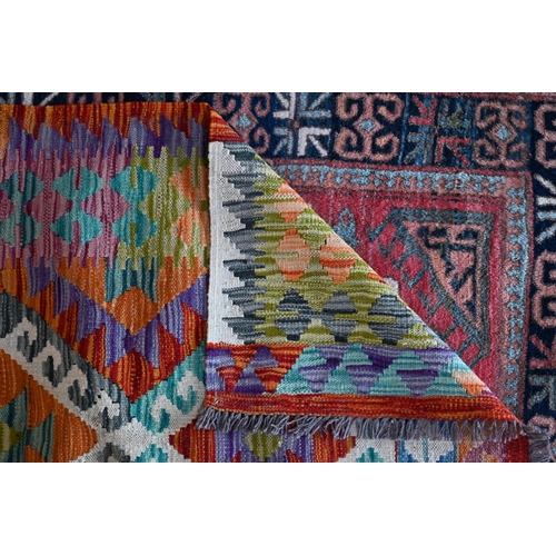 742 - A contemporary Anatolian kelim, with soft mult-coloured geometric lozenge design overall, 200 cm x 1... 