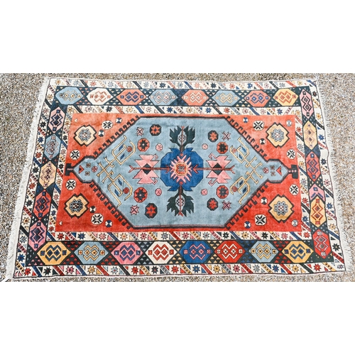 749 - A antique Kazak design carpet, the pale red ground with stylised floral design, 300 cm x 200 cm
