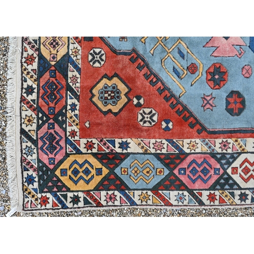 749 - A antique Kazak design carpet, the pale red ground with stylised floral design, 300 cm x 200 cm