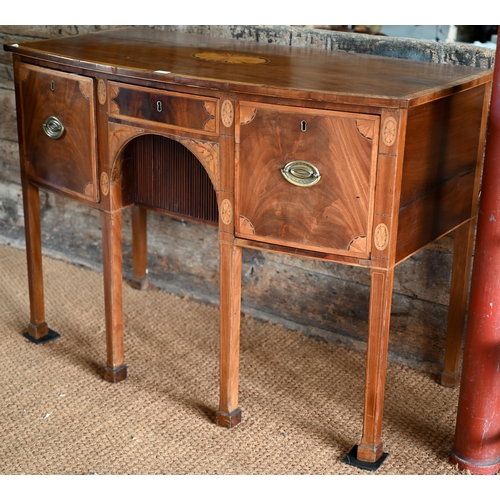 800 - A George III cross-banded and inlaid mahogany bow-fronted sideboard, centred by a frieze drawer over... 