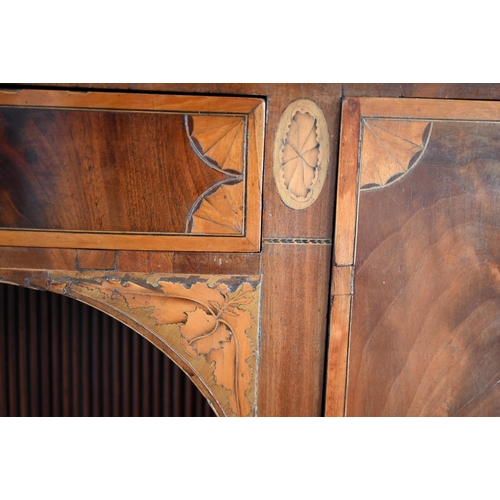 800 - A George III cross-banded and inlaid mahogany bow-fronted sideboard, centred by a frieze drawer over... 