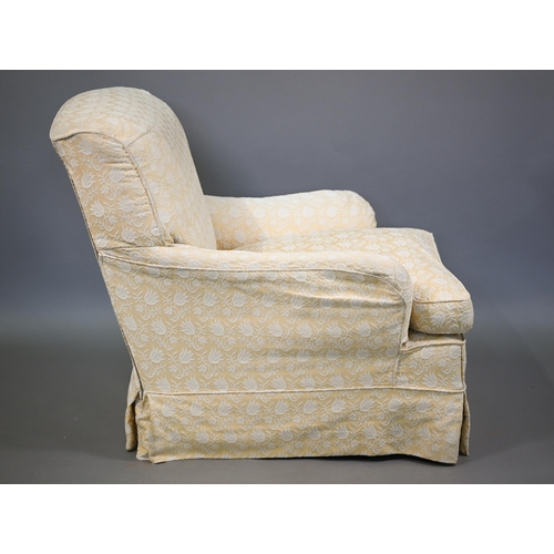 802 - A Howard style easy armchair, early 20th century, raised on short square section front legs to brass... 