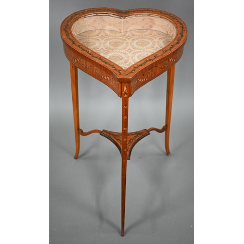 805 - A Sheraton Revival heart-shaped vitrine table, the hinged glazed-in top with fabric lined interior, ... 