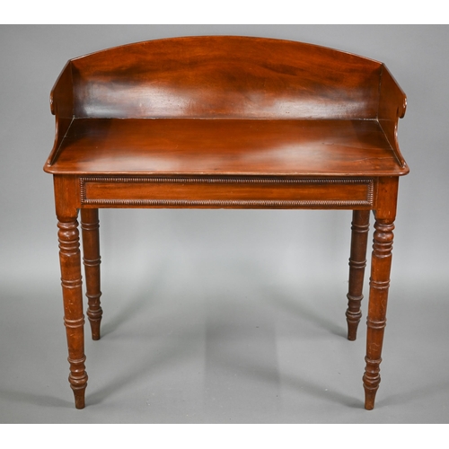 823 - A Victorian mahogany stand, the top with 3/4 gallery over a bead moulded frieze and raised on ring-t... 