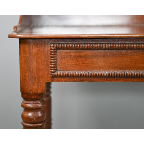 823 - A Victorian mahogany stand, the top with 3/4 gallery over a bead moulded frieze and raised on ring-t... 