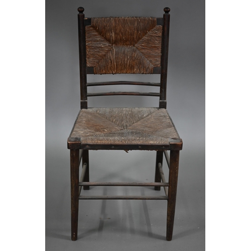 825 - Four Arts & Crafts Morris style Sussex stained ash chairs with rush seats, comprising an open ar... 