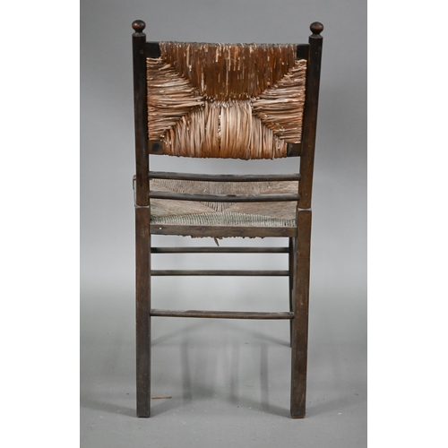 825 - Four Arts & Crafts Morris style Sussex stained ash chairs with rush seats, comprising an open ar... 