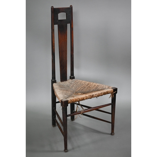 826 - An Arts & Crafts Glasgow School oak high back chair with rush seat, probably by John Ednie (1876... 