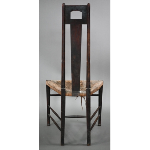826 - An Arts & Crafts Glasgow School oak high back chair with rush seat, probably by John Ednie (1876... 