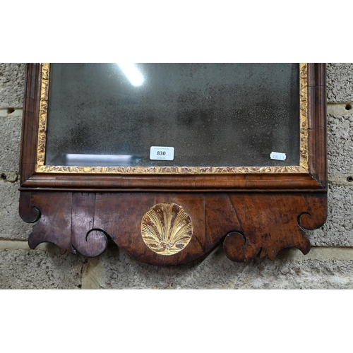 830 - A George II walnut and parcel gilt fret cut pier glass, the original distressed bevel edge plate wit... 