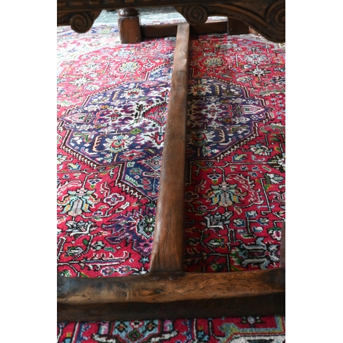 833 - A 17th century and later composed oak refectory table, the wide two plank top with cleated ends rais... 