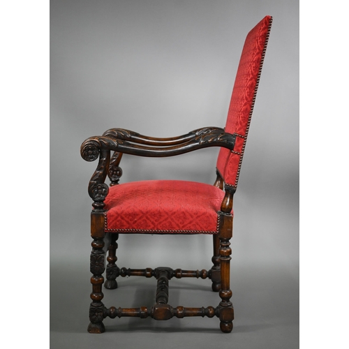 836 - A pair of 17th century style carved walnut throne armchairs, with studded rouge fleur-de-lys pattere... 