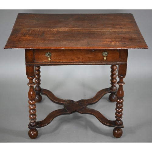 845 - An early 18th century oak single drawer side table, raised on part bobbin turned supports united by ... 