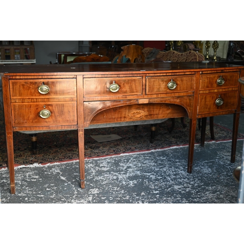 850 - A Georgian cross-banded and ebony line inlaid mahogany bow-fronted sideboard, centred by a pair of s... 