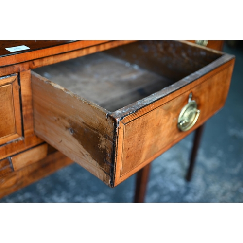 850 - A Georgian cross-banded and ebony line inlaid mahogany bow-fronted sideboard, centred by a pair of s... 