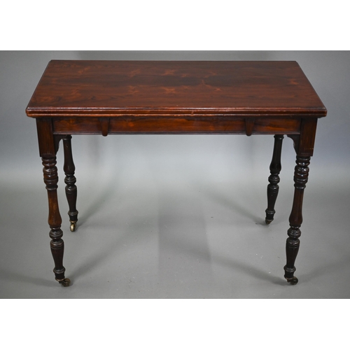 855 - G. Trollope & Sons, London, a rosewood card table, the rectangular fold over top enclosing a gre... 