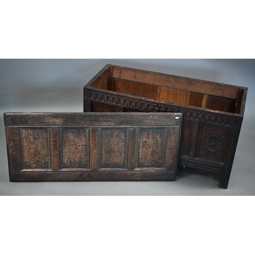 859 - A late 17th century joint oak coffer, the four panel top over a carved and moulded four panel front,... 