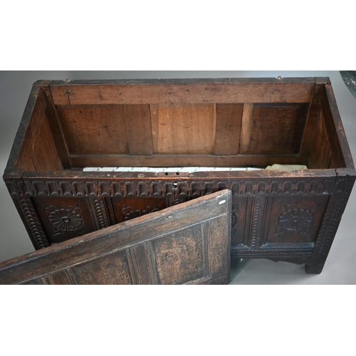 859 - A late 17th century joint oak coffer, the four panel top over a carved and moulded four panel front,... 